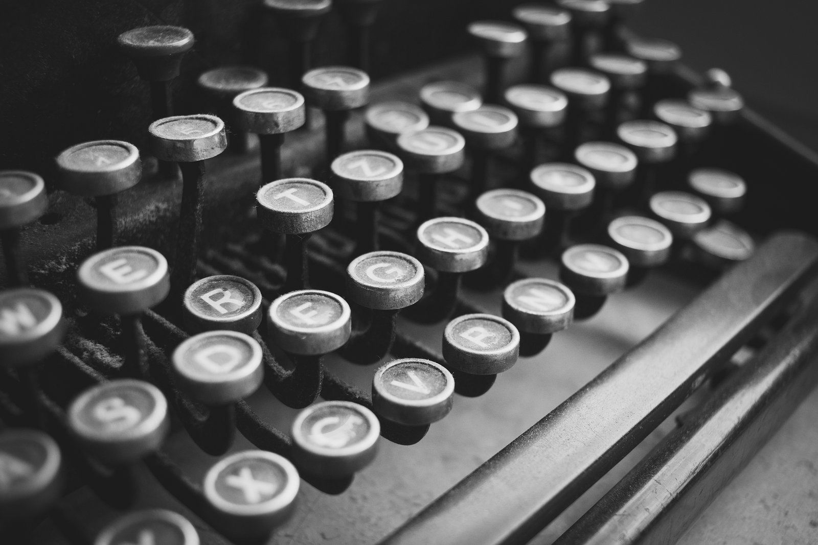 Close-up of a vintage typewriter keyboard, letters worn from use